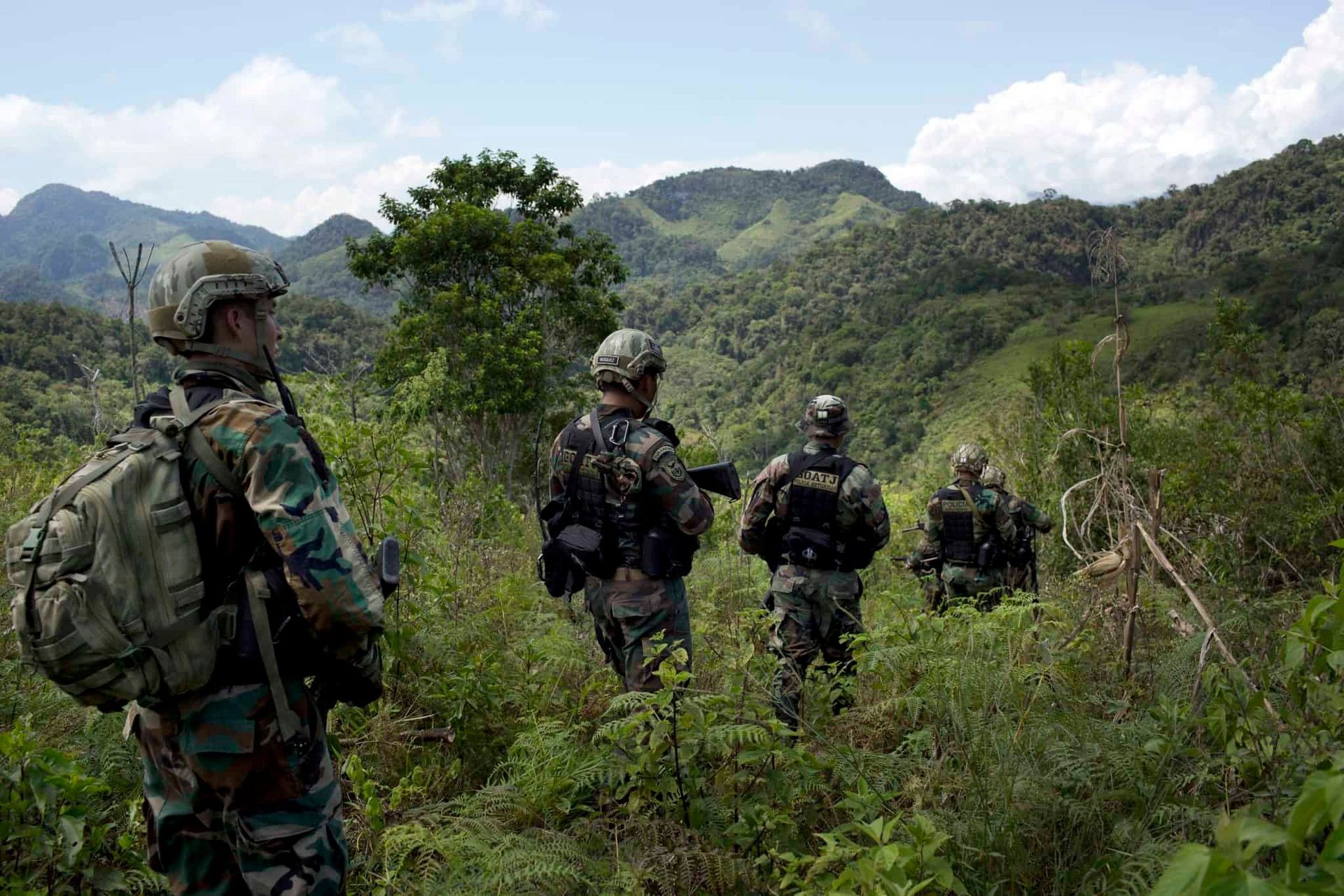 Soldiers going on mission in woodland camo in South Central America with weapons in Las Vegas Nevada